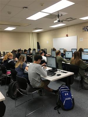 Students working at computers in a computer lab 